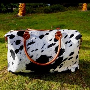 Brown/white cow print weekender bag